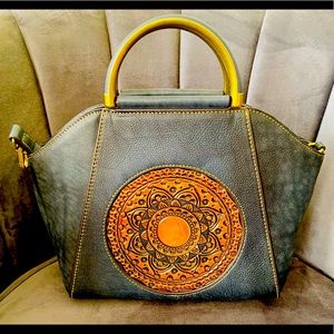 Medium-small size handbag in like new condition; no damages, stains or scratches